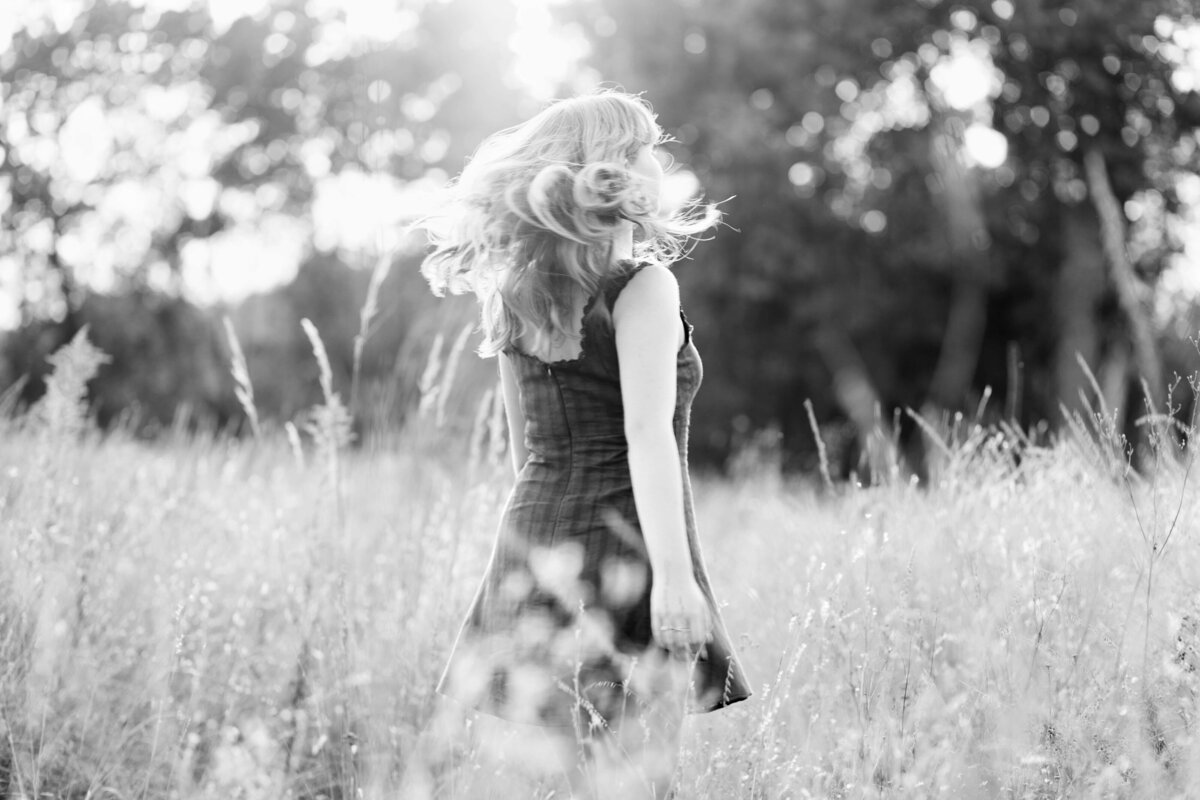 girl spinning in field