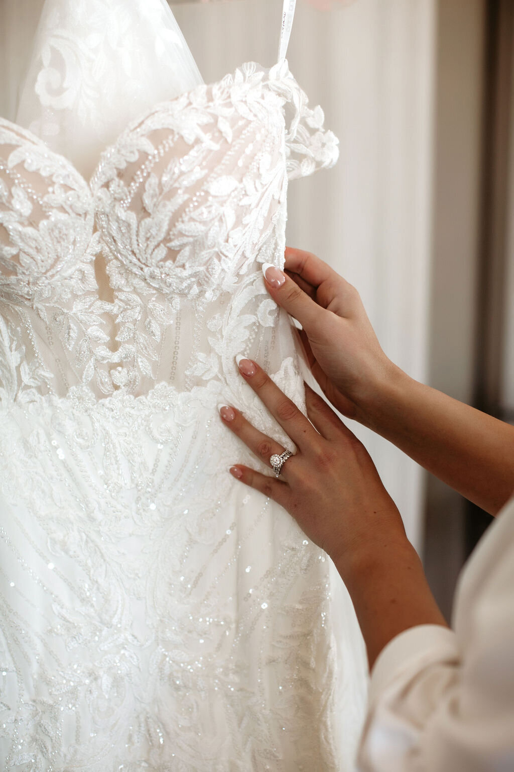 Bride with her lace wedding gown.