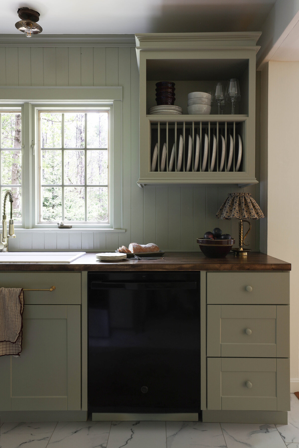 Moody Rustic Laundry Room renovation by Nadine Stay | Dark wood stained walls. Brown painted doors. DIY Ikea Pax hack. DIY mudroom built in cabinet. DIY shaker cabinet doors. DIY inset drawers. Basketweave brick floors.