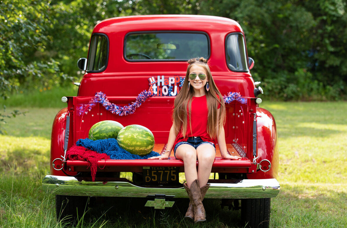 girl-in-vintage-red-truck-4th-of-junly-themed