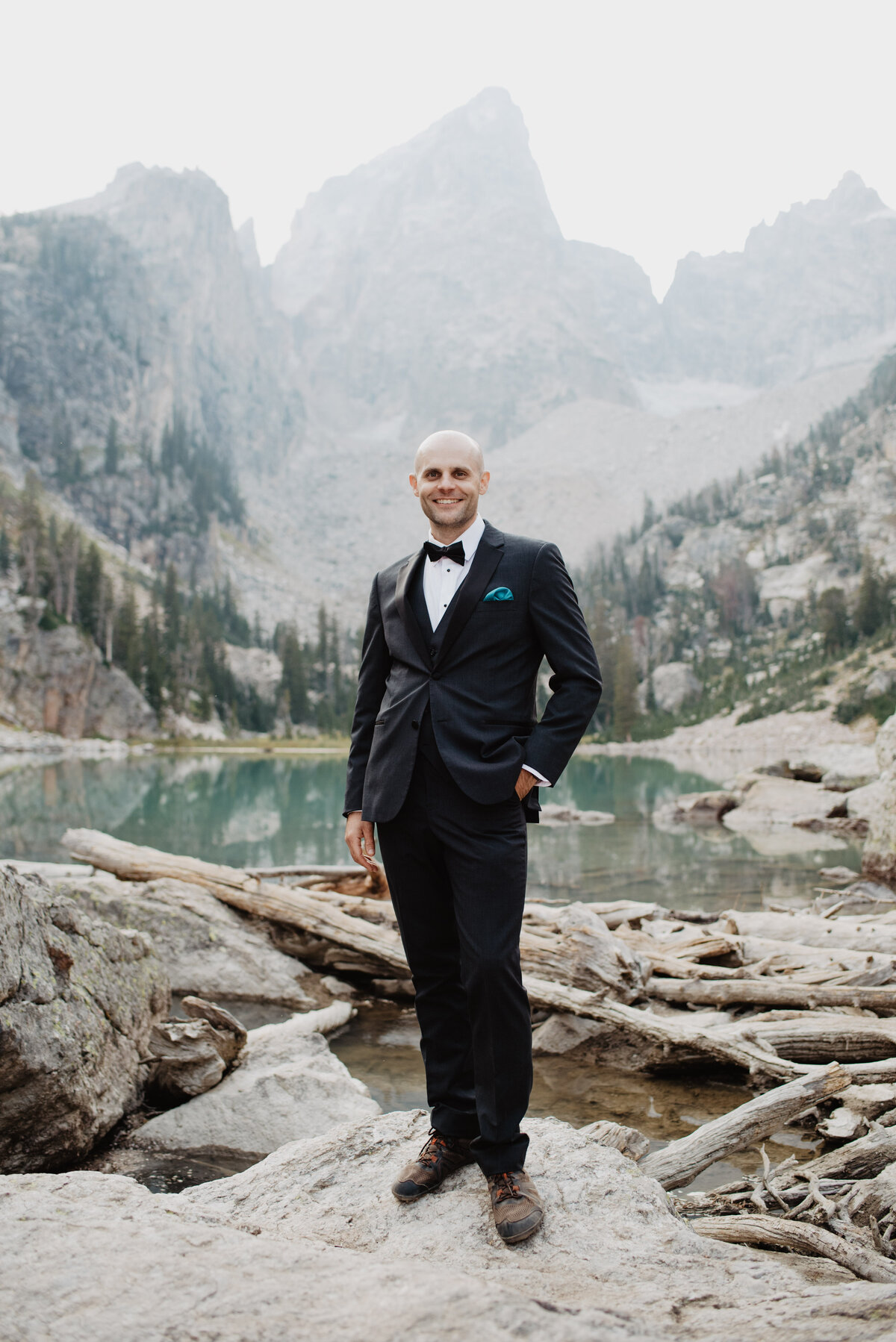 Jackson Hole Photographers capture groom standing on rock