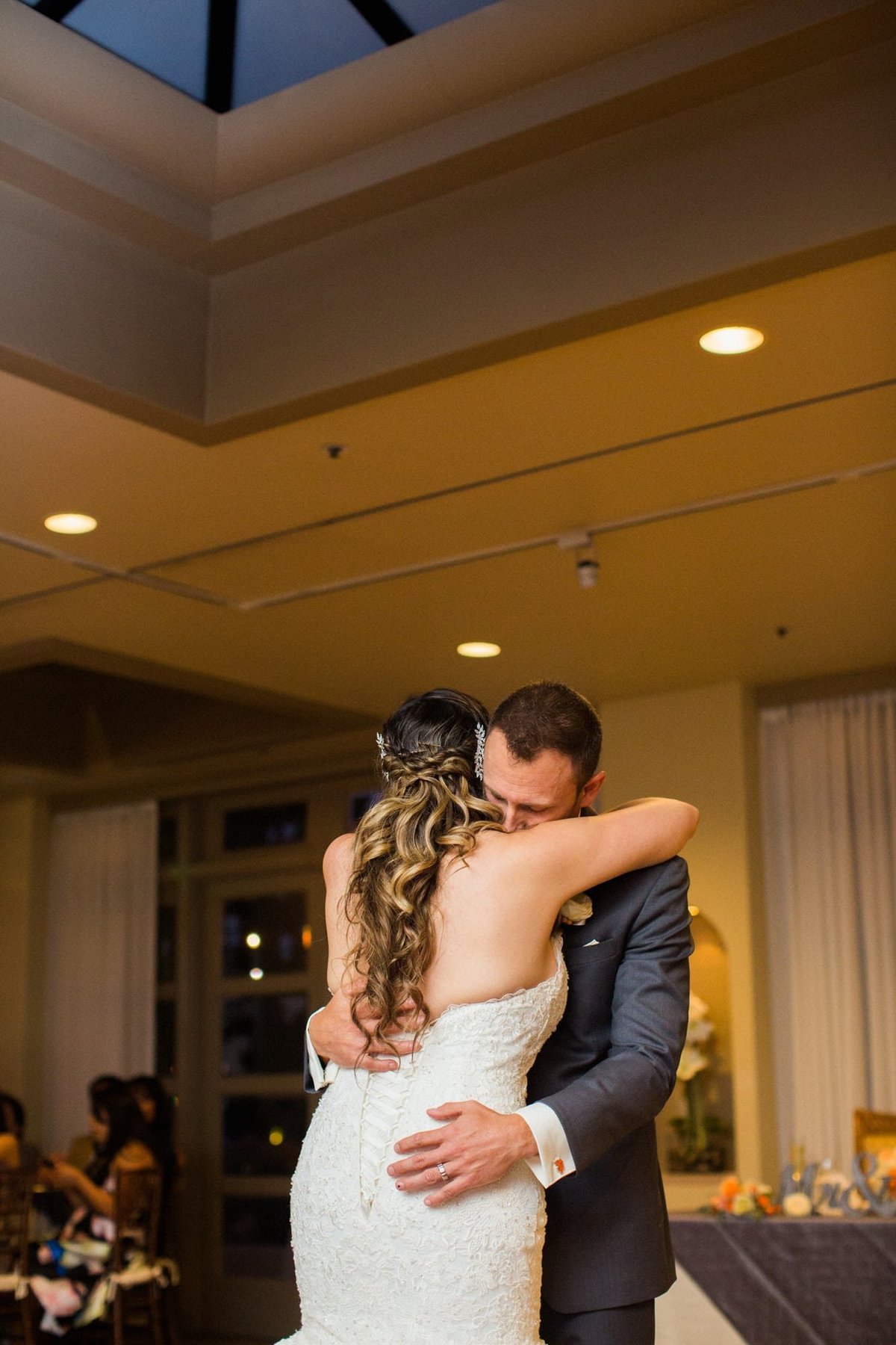 Bride and Groom embrace during their first dance