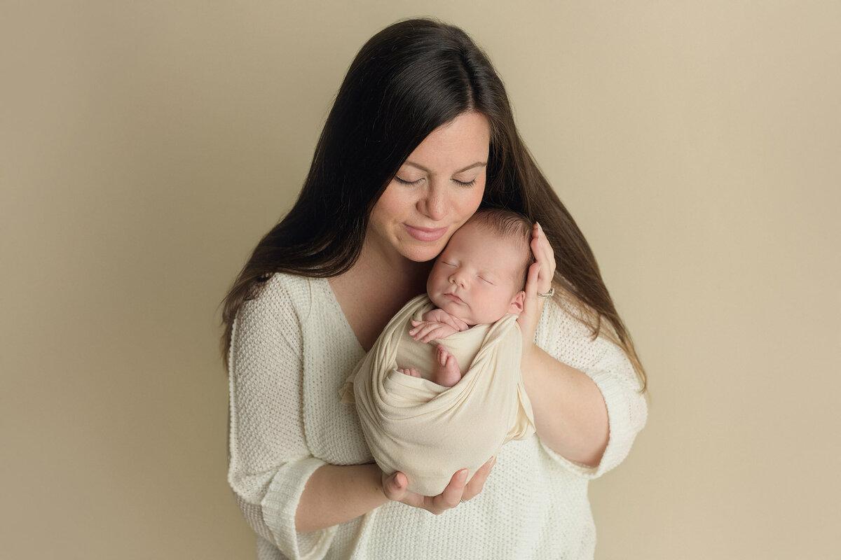 Boston mother holding newborn baby boy