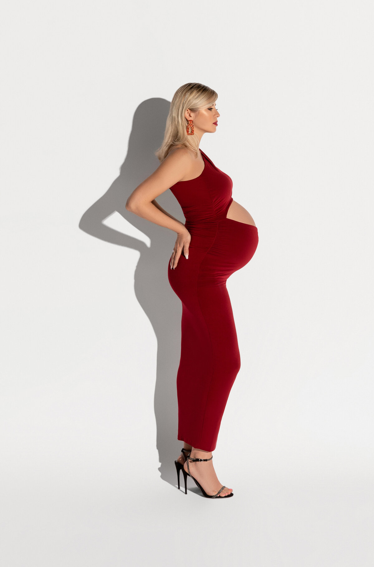 maternity photography with red dress