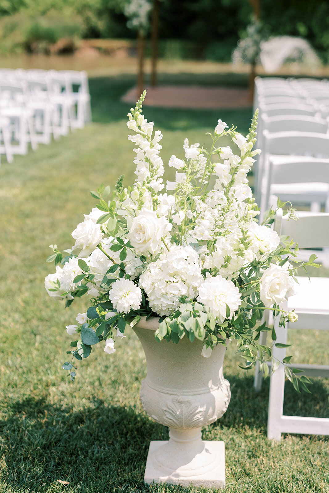 Floral aisle arrangement at outdoor wedding in Mechanicsburg