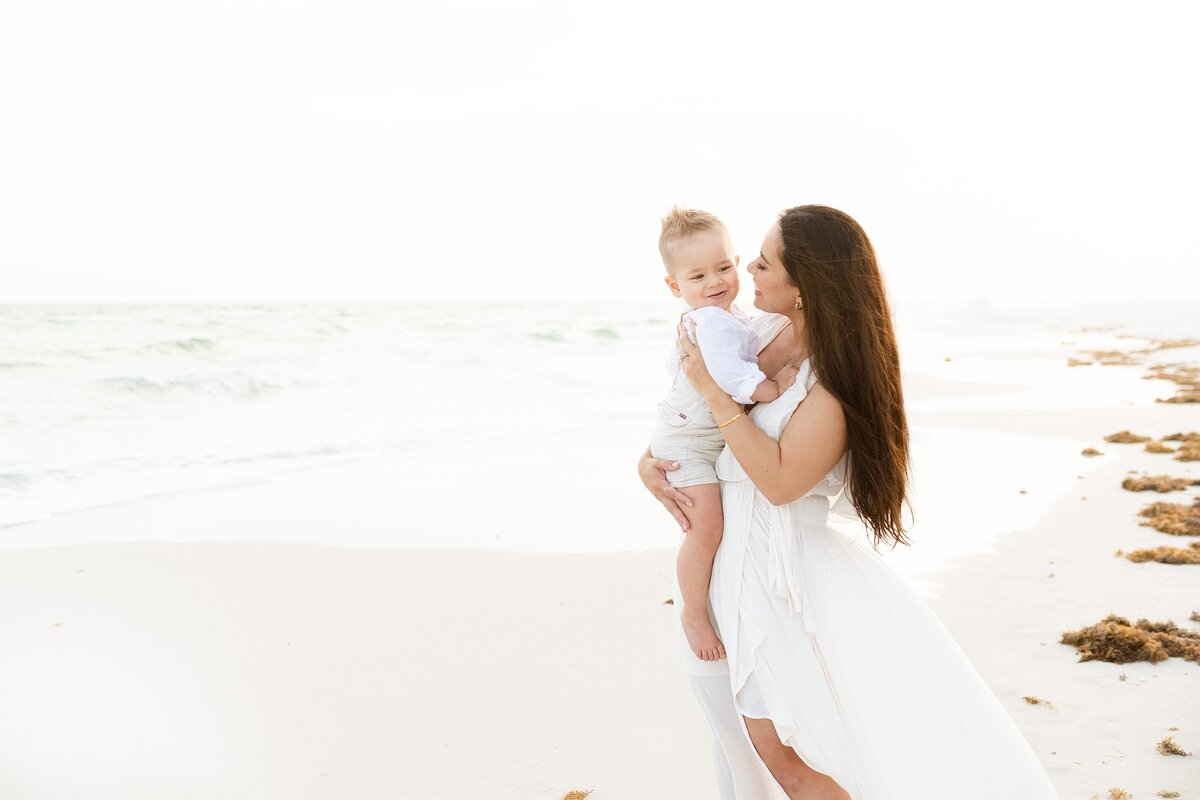a mother at the beach with Destin family photographers
