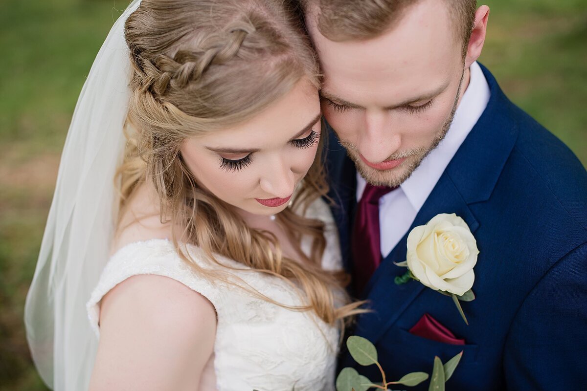 wedding couple looking down with focus on faces