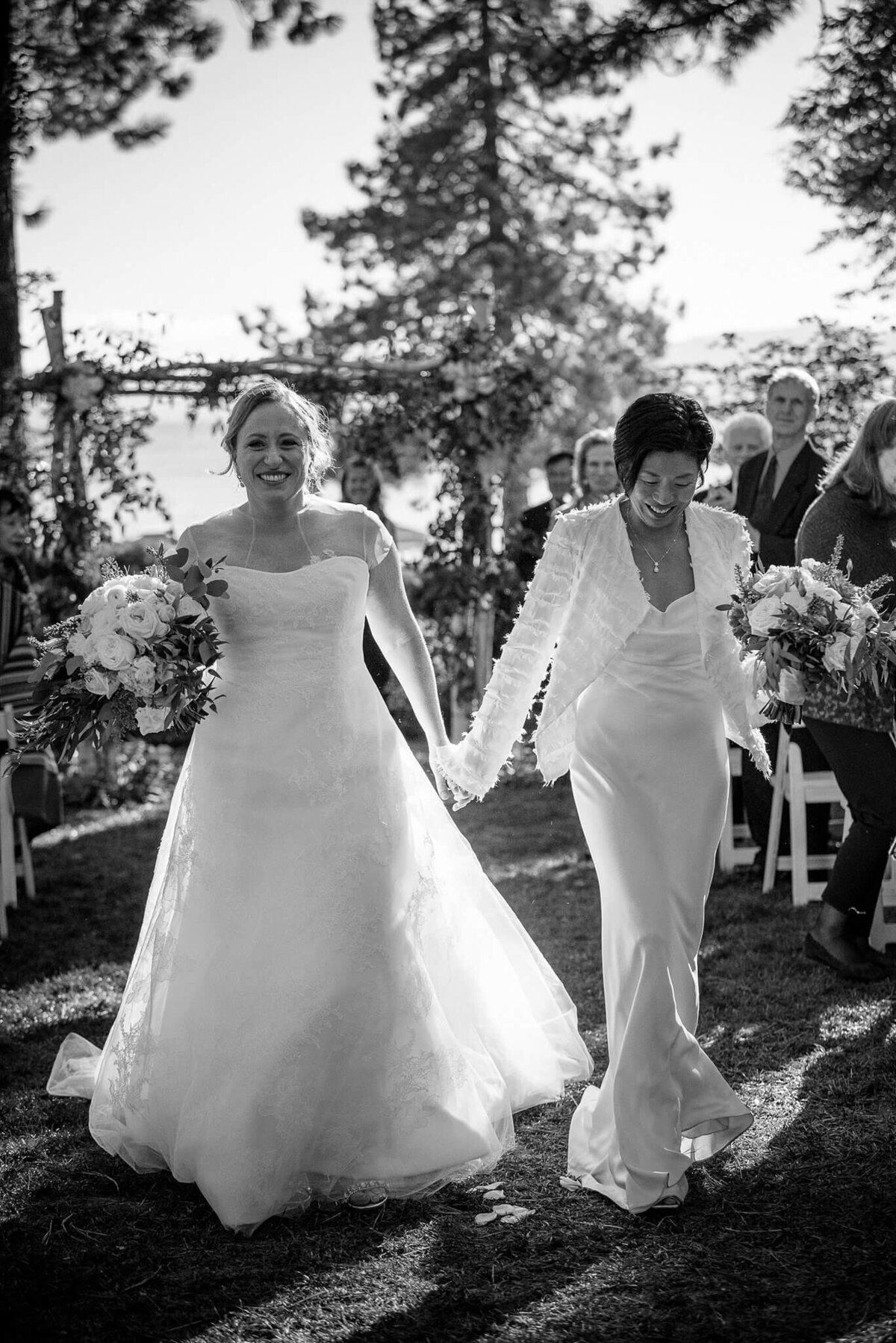 two brides just married  walking down the aisle at Hyatt tahoe