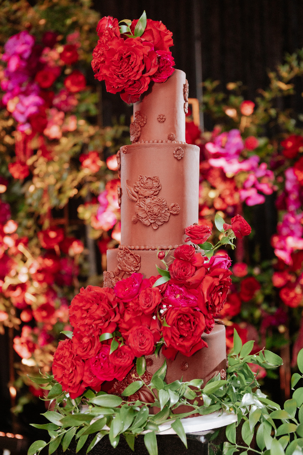 black-gold-pink-burgundy-wedding-reception-floating-candles-greenery-red-roses-cake