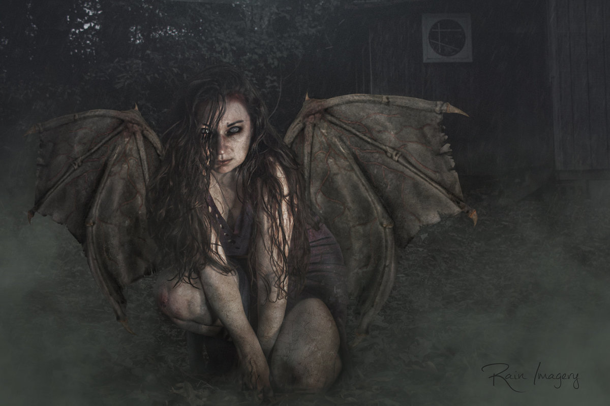 Spooky photo art of a female creature with bat wings