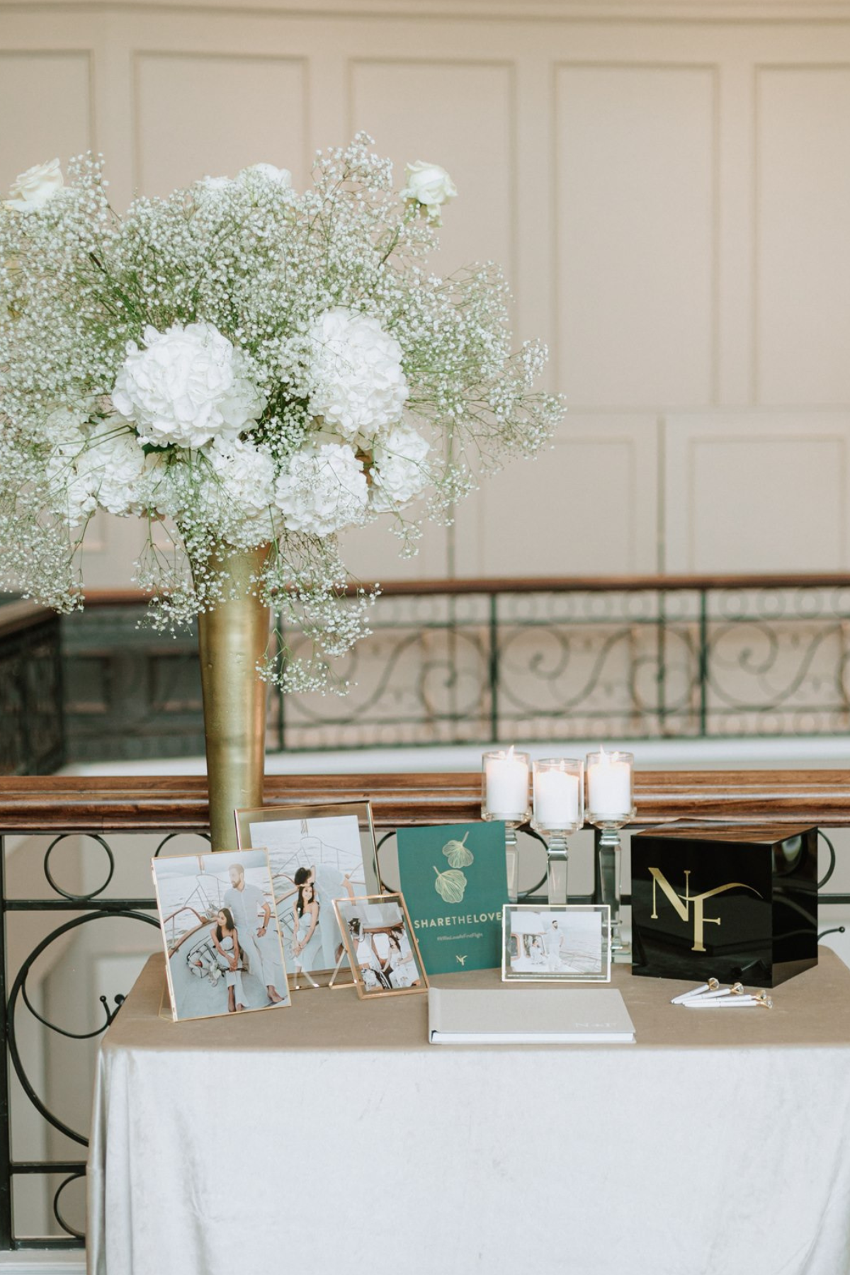 green-gold-wedding-reception-babysbreath-candles-entrance-table