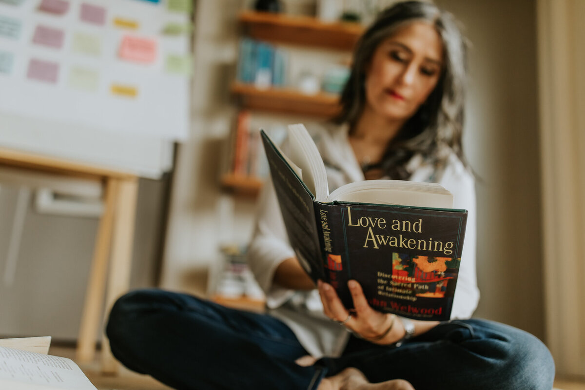 Bay Area creative headshot of woman reading book called love and awakening