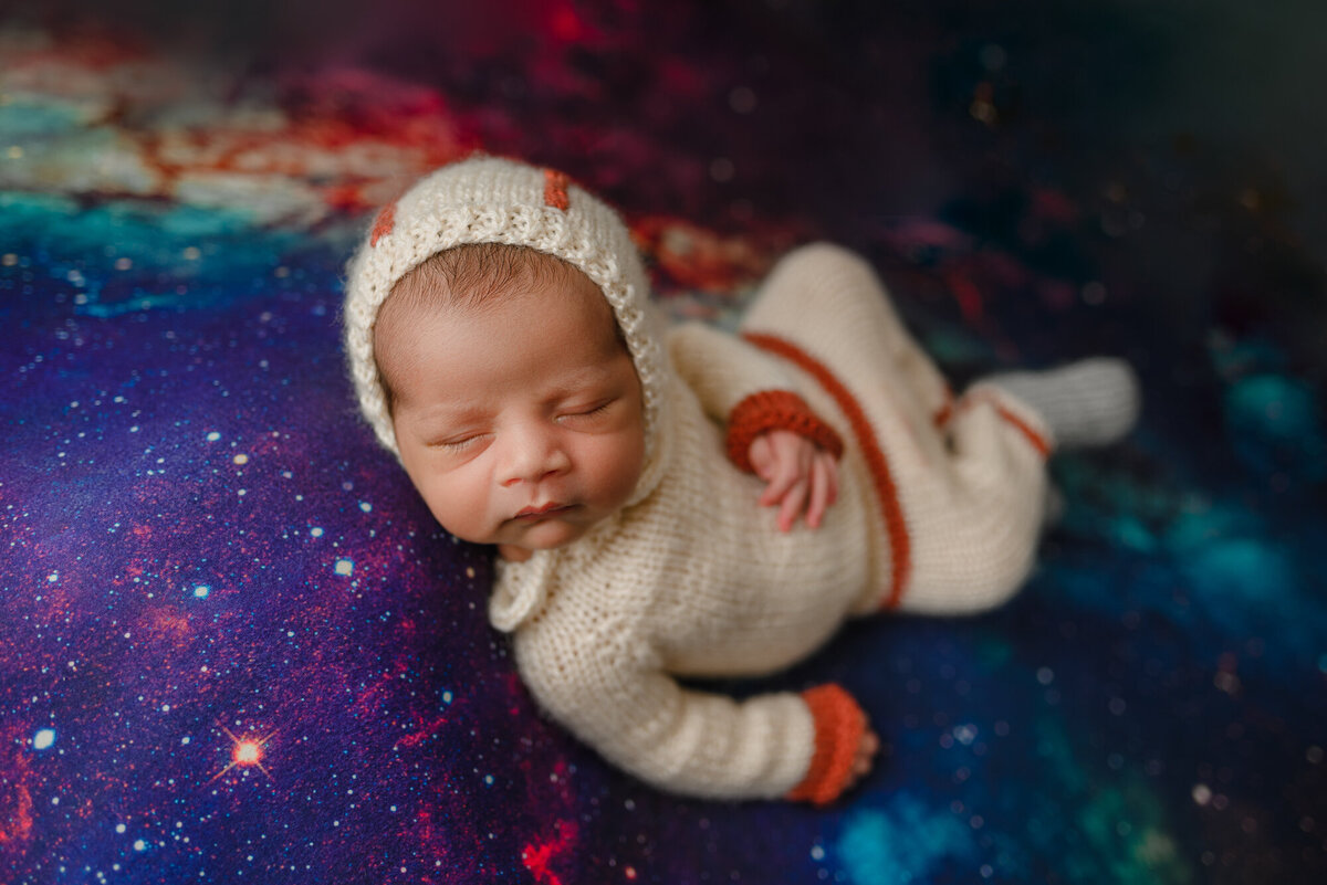 Astronaut space baby suit on galaxy backdrop at West Seattle Studio