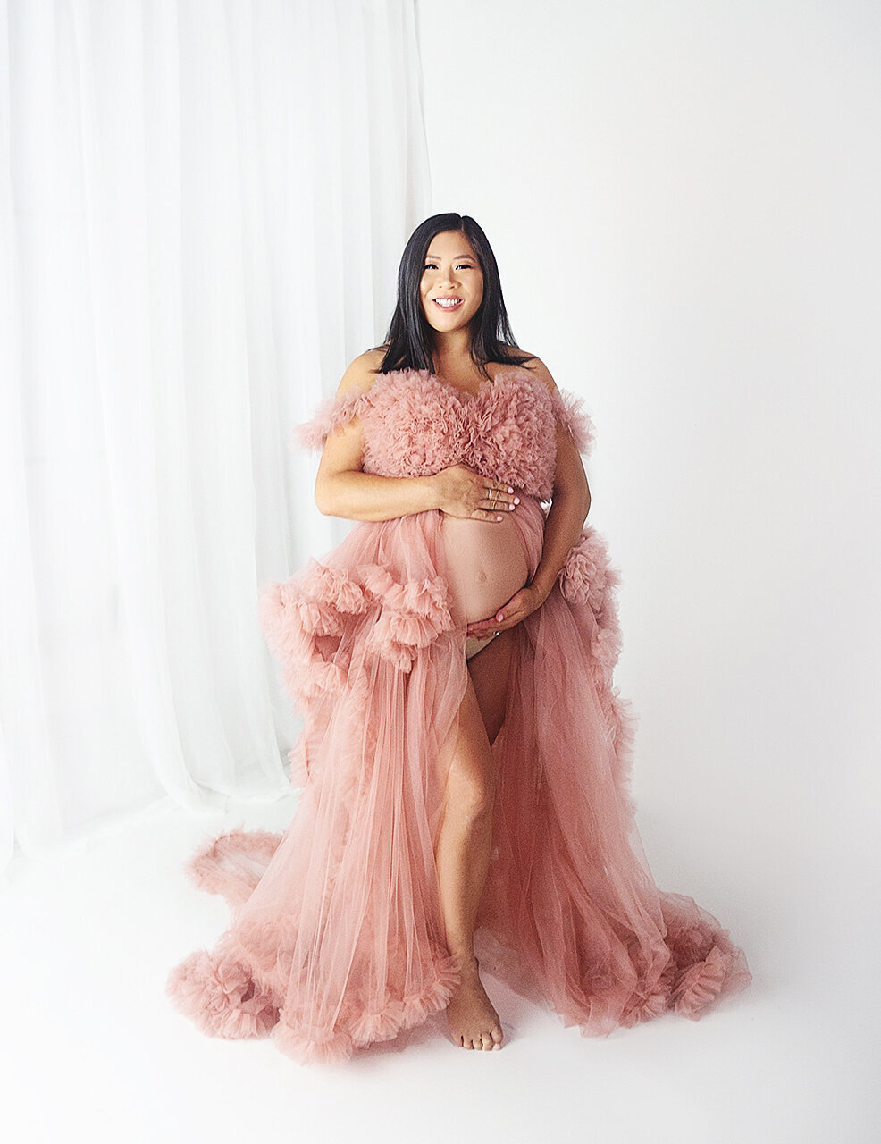 Woment wearing pink maternity gown