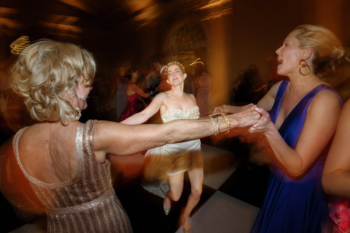 Bride dancing with wedding guests