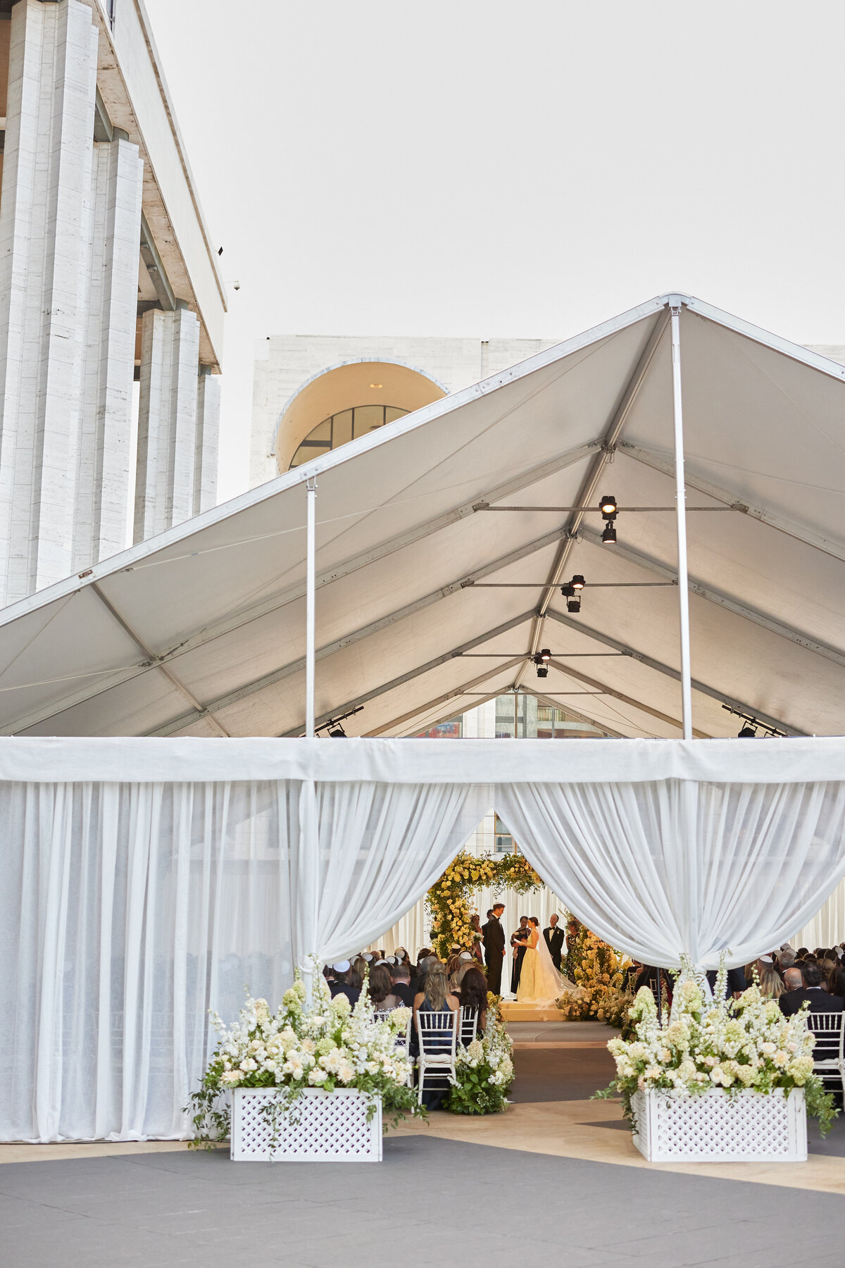 outside view of wedding ceremony  in tent