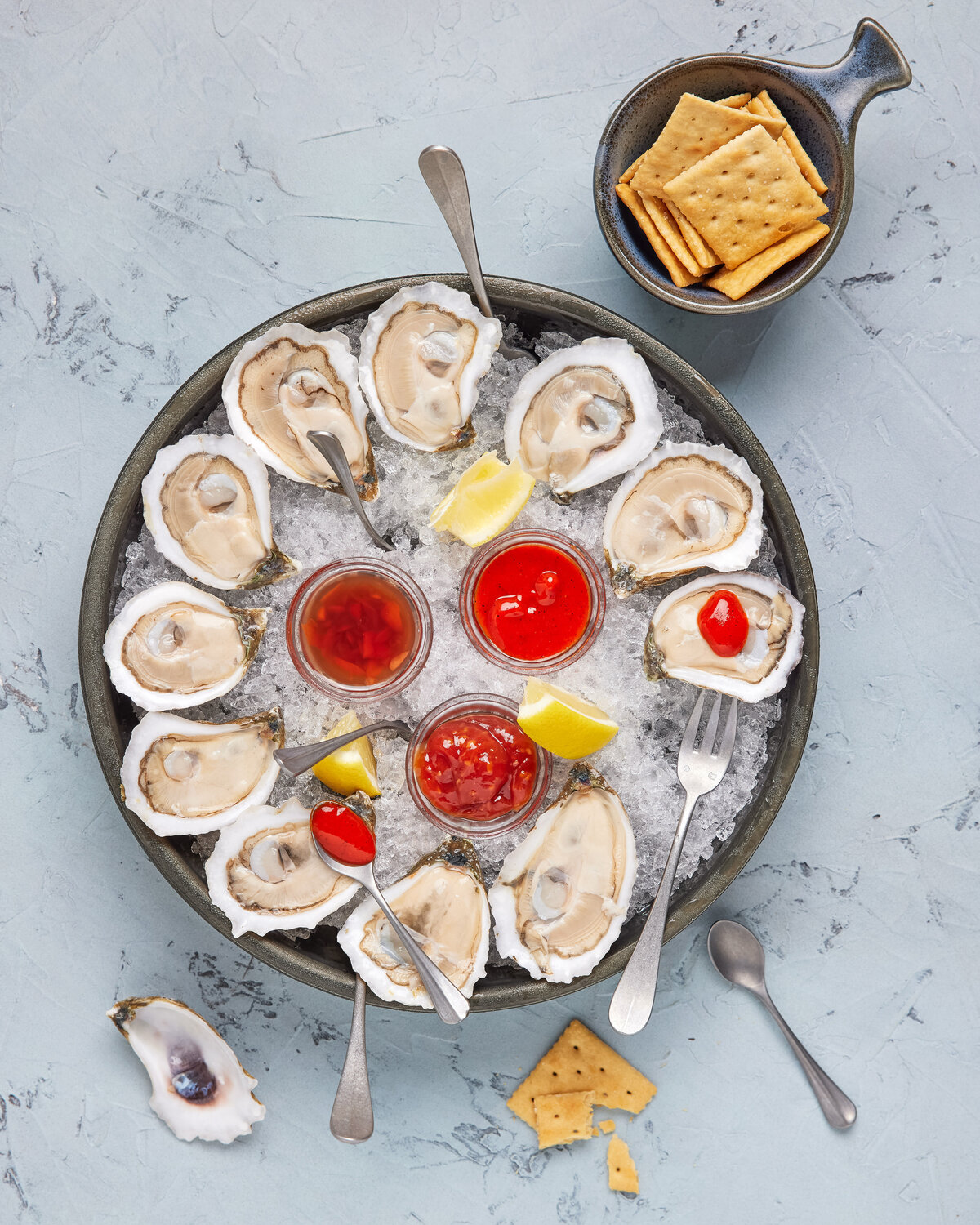 Oysters with dipping sauce in the middle