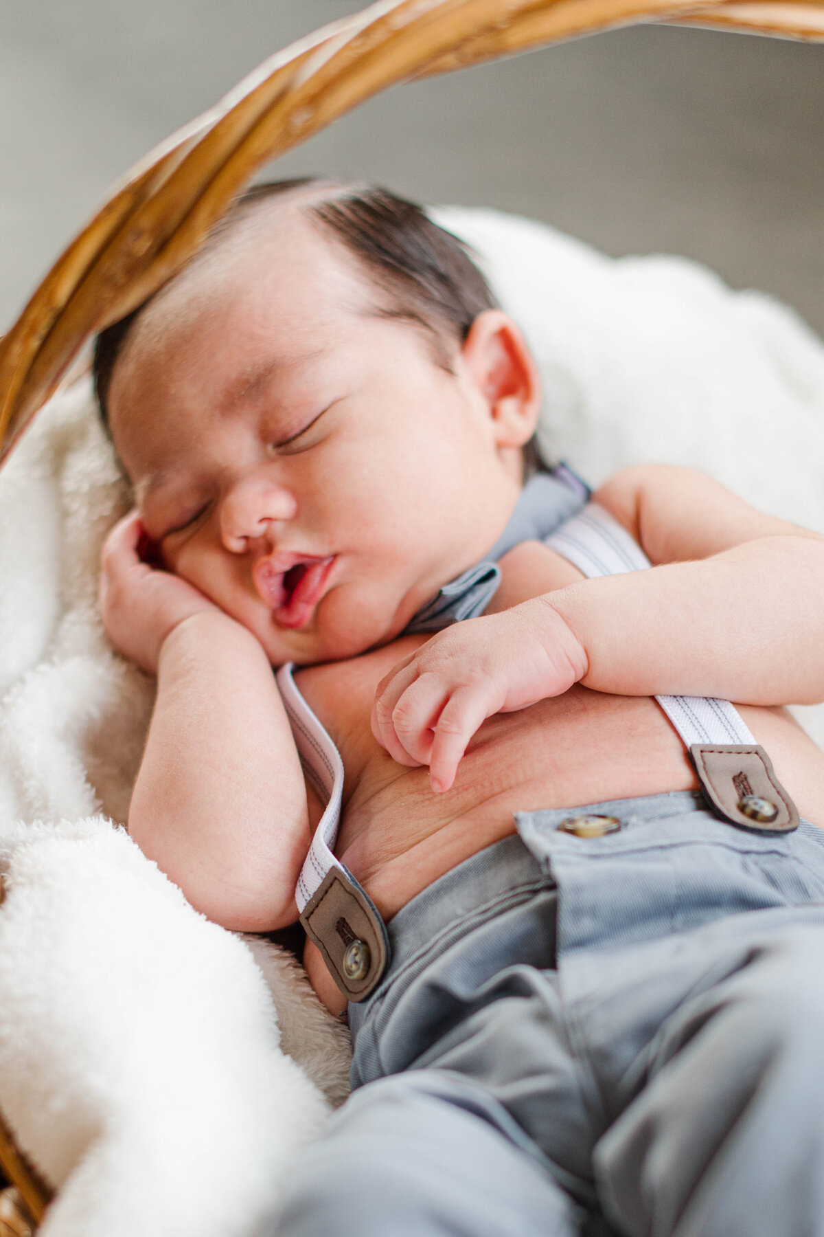 baby sleeping in a basket