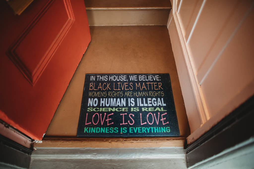 Door mat details saying love is love and black lives matter at San Francisco in home photography session