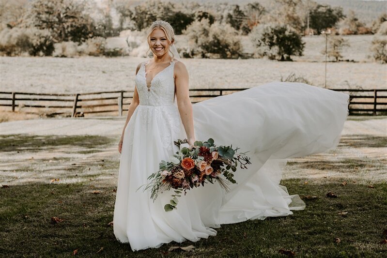 Bride in white flowing dress with her bridal bouquet