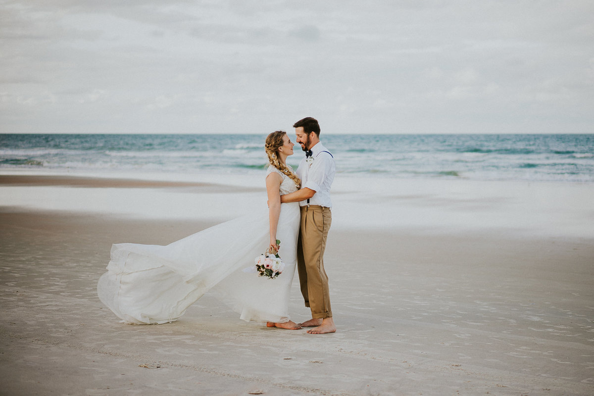 Daytona Beach elopement wedding couple embraces on Ormond Beach