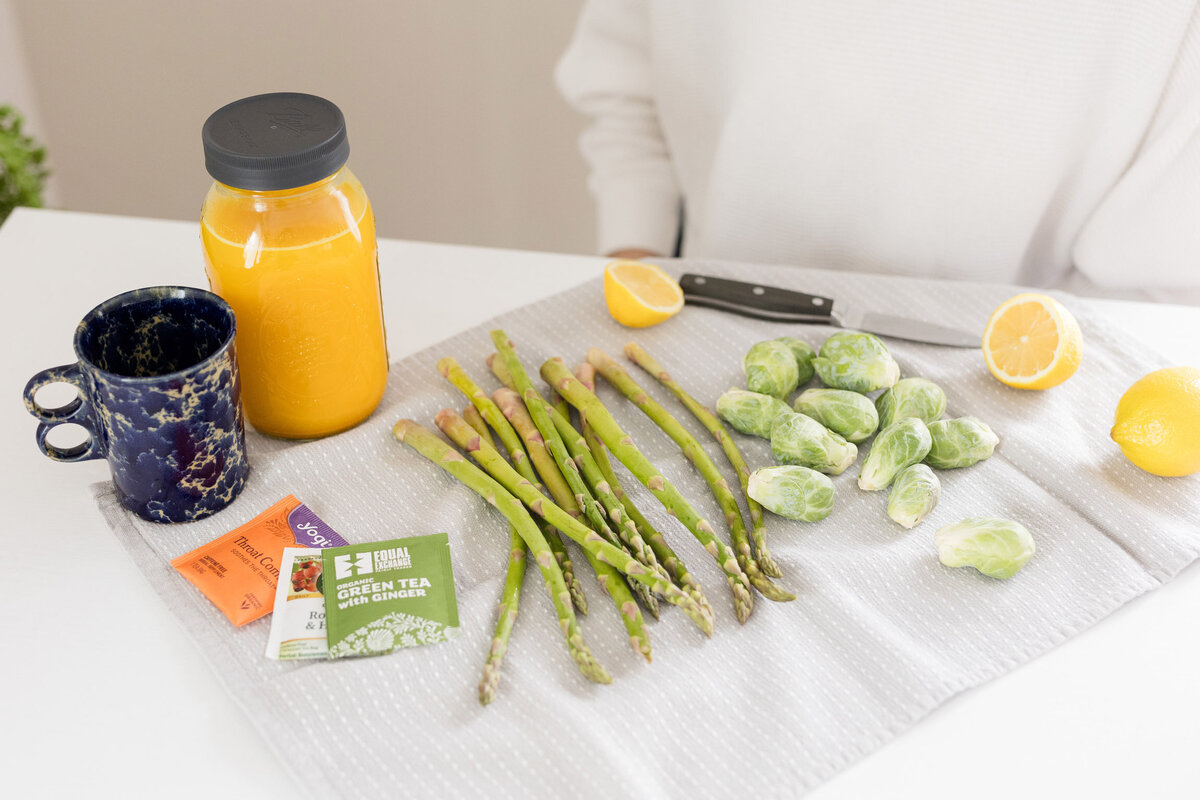 Grace with an array of vegetables on a counter