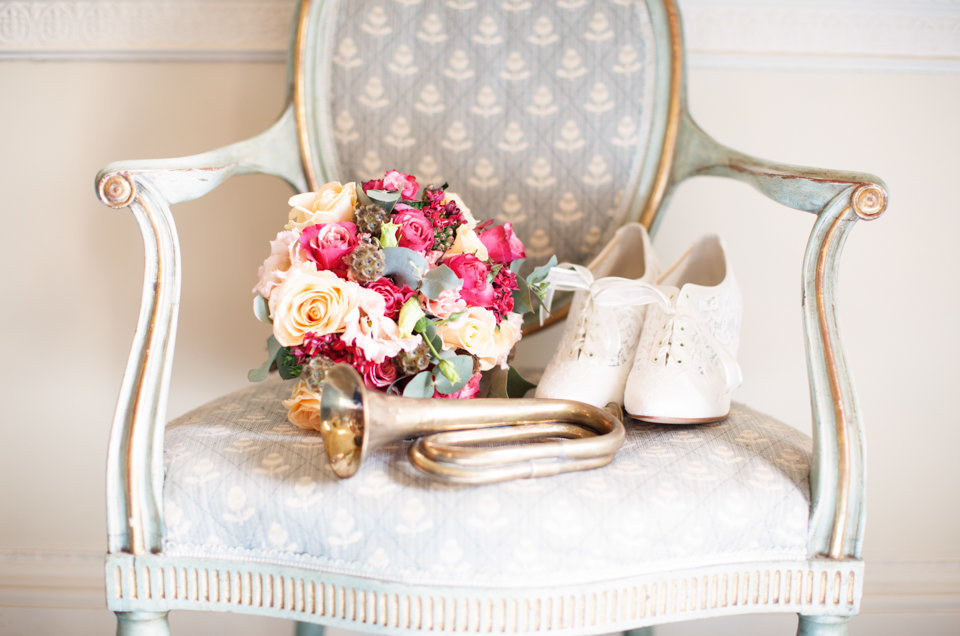 brides bouquet and shoes on a chair - BANNER