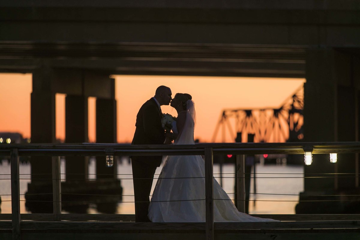 Sunset photo of the bride and groom at Bridgeview Yacht Club
