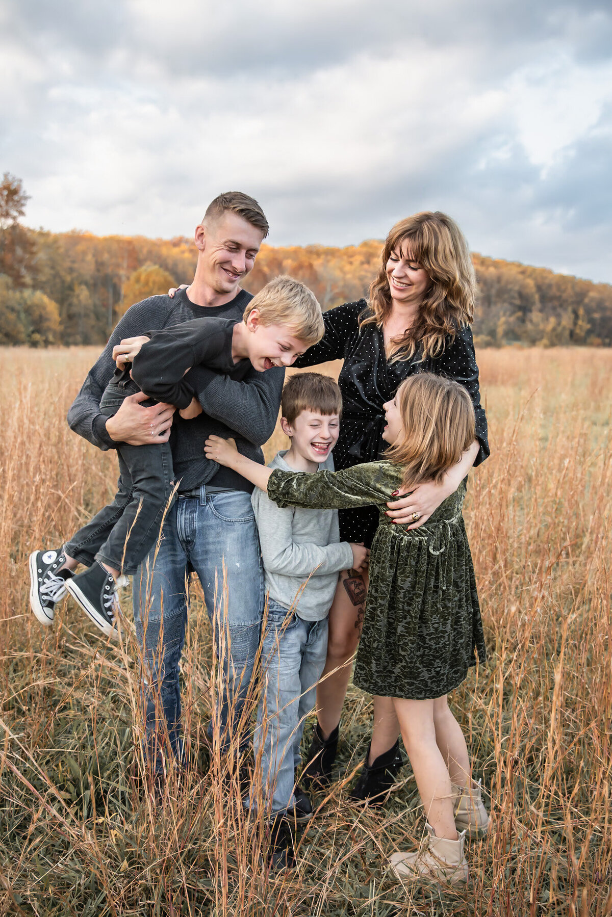 Parents tickling their kids during family photoshoot at Jersualem Mills in Maryland