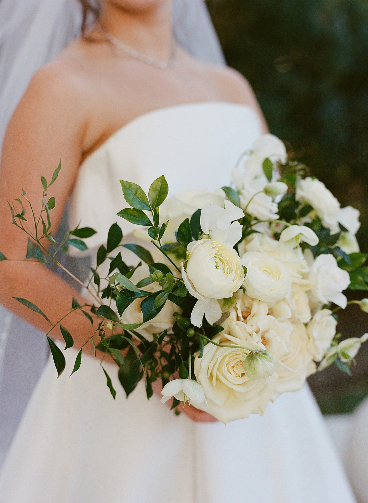 Classic white rose and ranunculus wedding bouquet