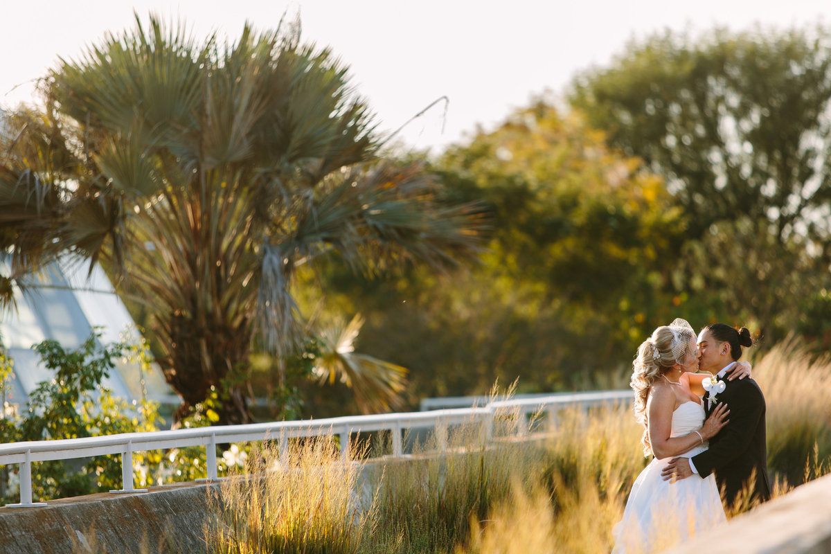 bride and  groom kissing at San Antonio Botanical Garden by Wedding photographer Expose The Heart