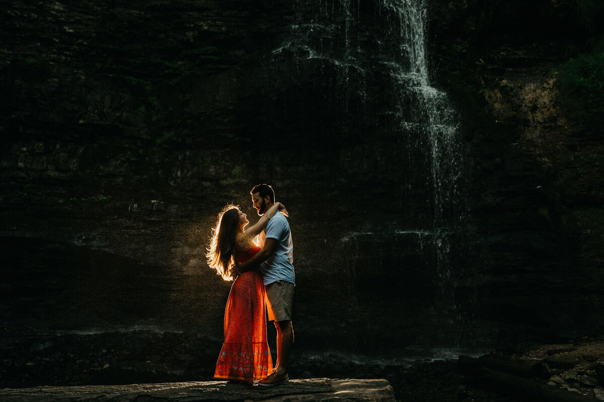 Couple holding each other at Tiffany Falls - Shot by Toronto Wedding Photographer