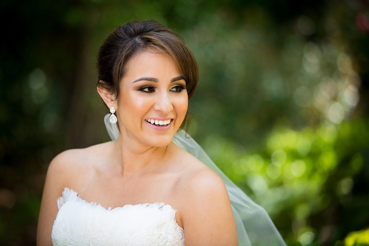 Twin Oaks wedding photos bride smiling with veil blowing