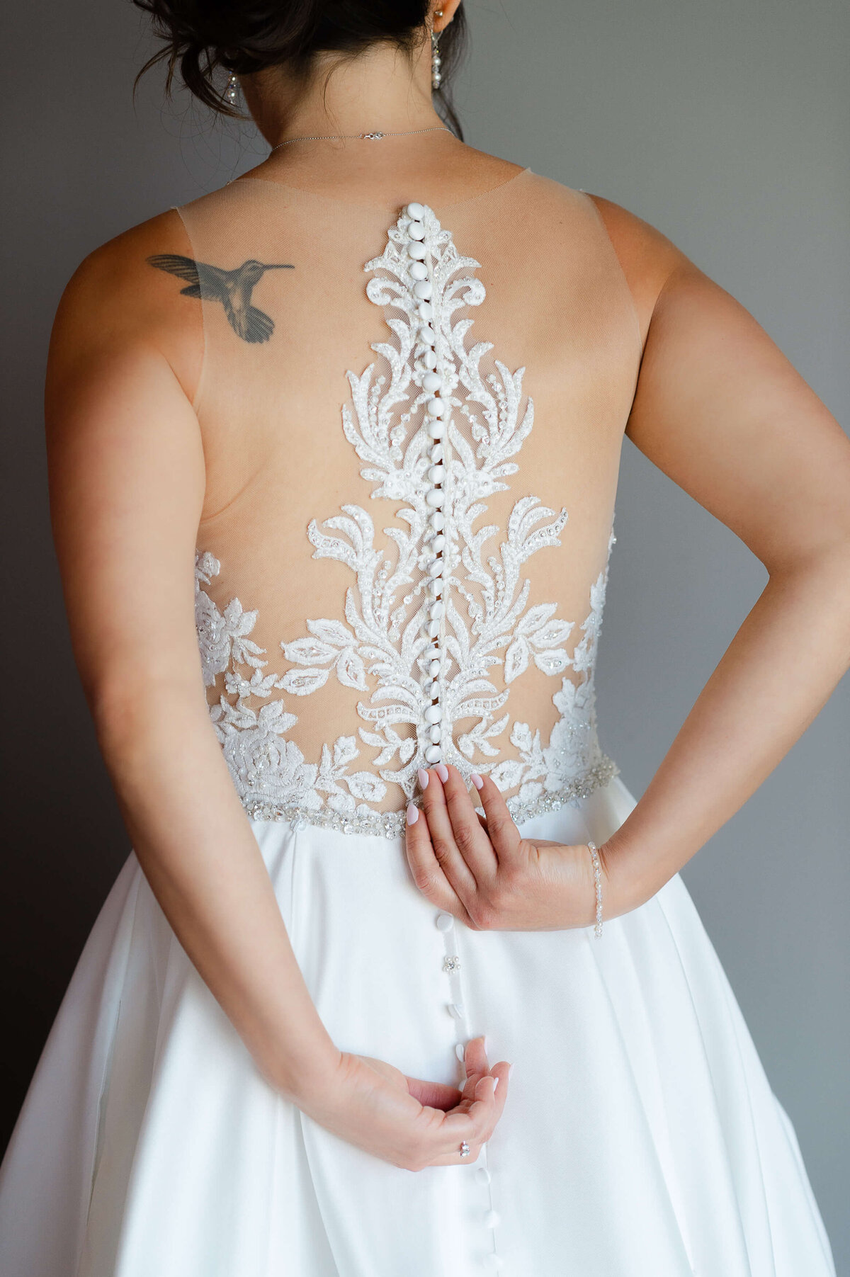 Ottawa wedding photography showing the back details of a wedding gown at the Brookstreet Hotel