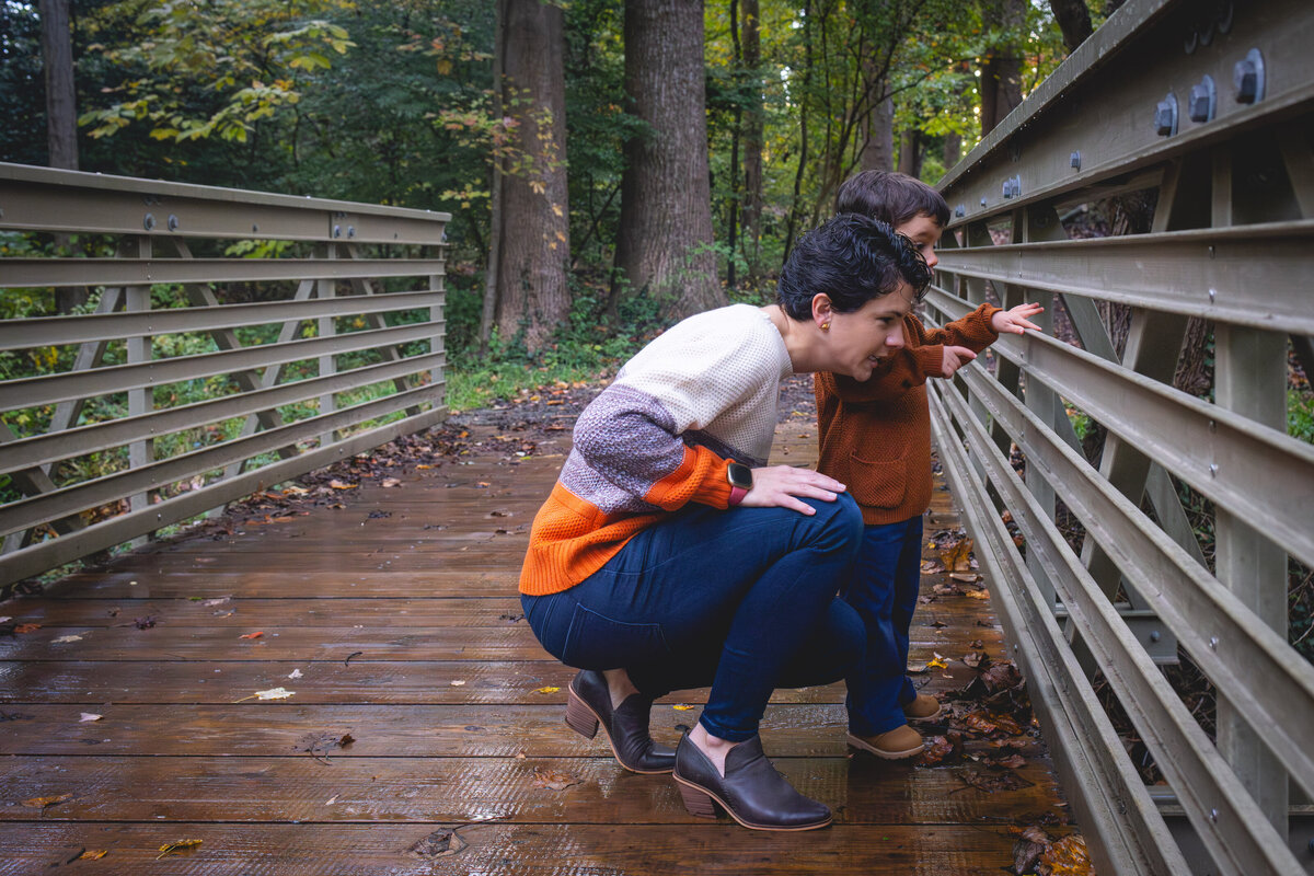 Mother and son on bridge in fall