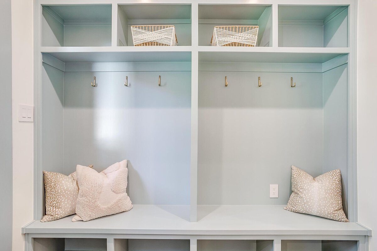 cocoloba homes cockrell ave mudroom shelves painted in blue color