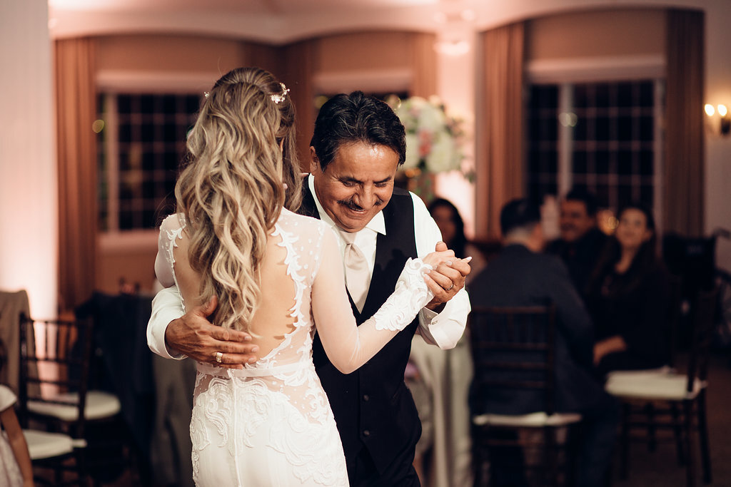 Wedding Photograph Of Bride Dancing With Man In Black Suit Los Angeles
