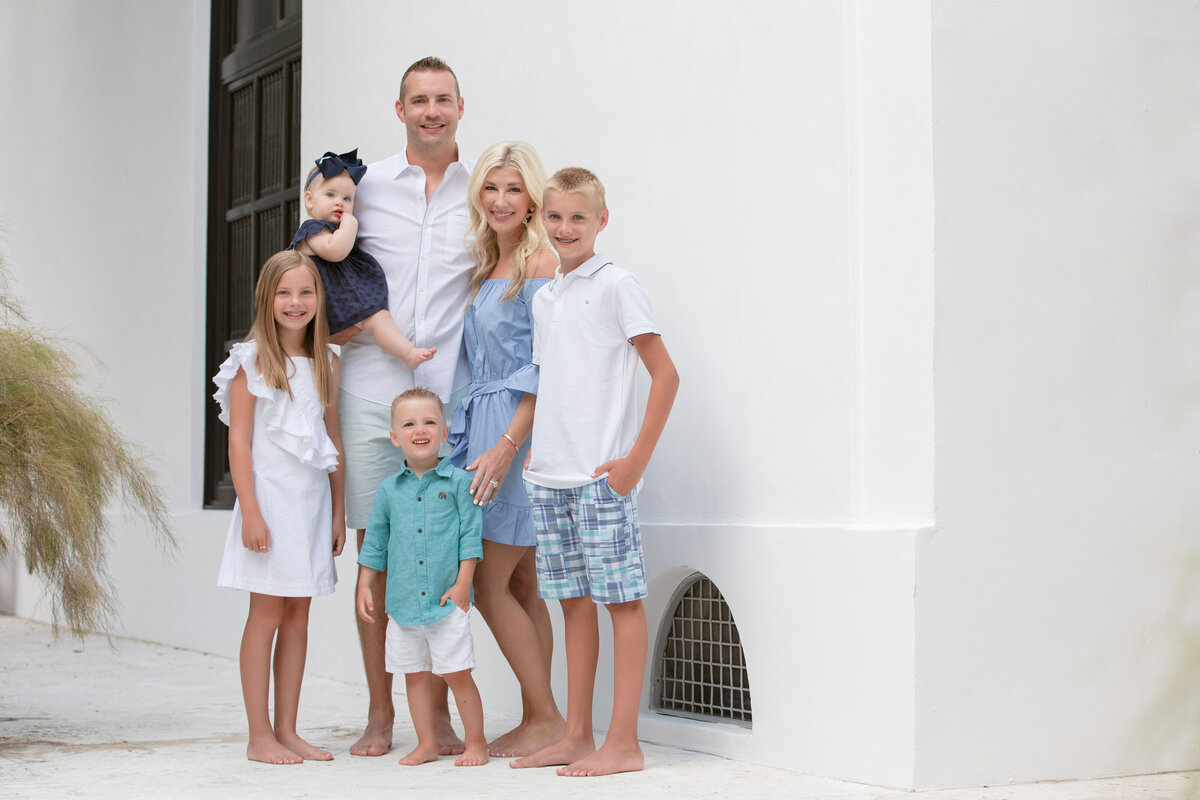 A family standing together and smiling