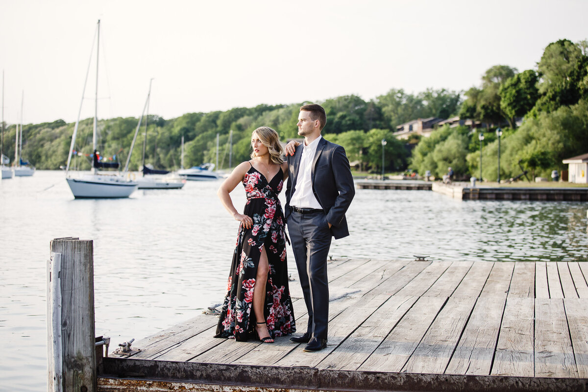 Engaged couple standing on dock of Buffalo Outer Harbour, New York