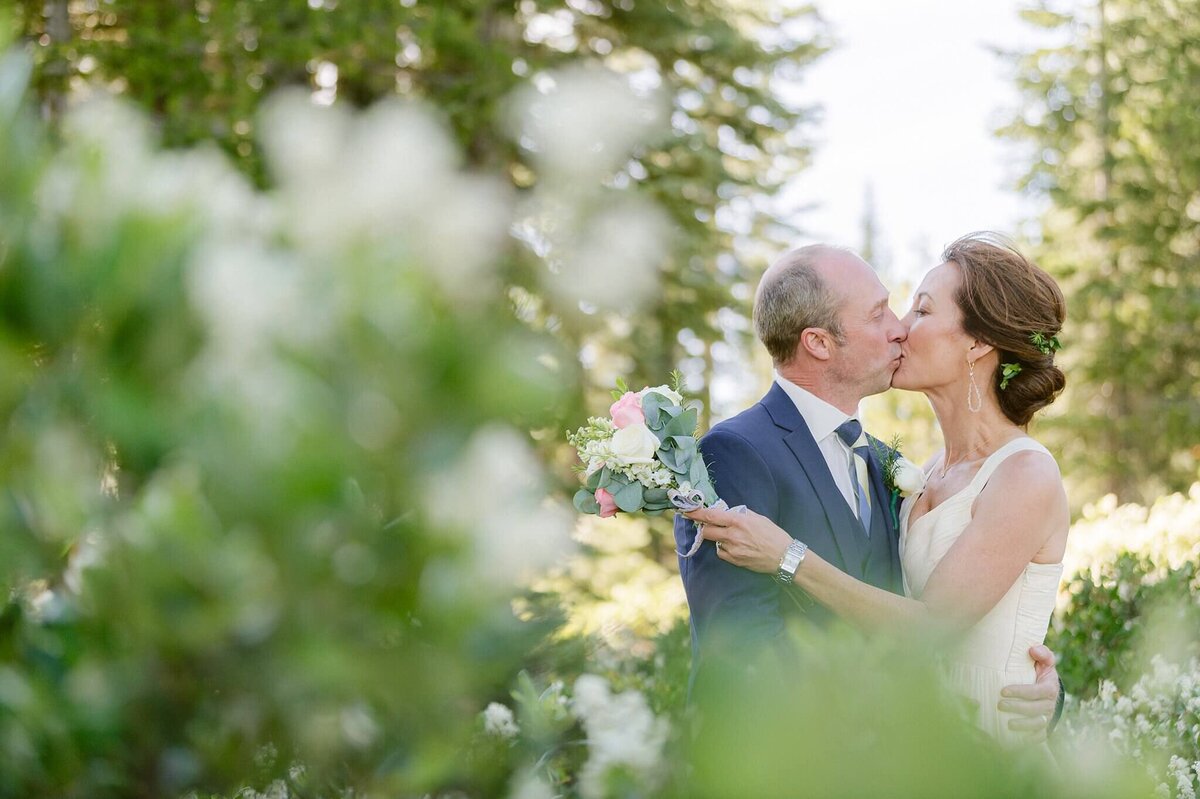 couple kissing during portraits in truckee after wedding