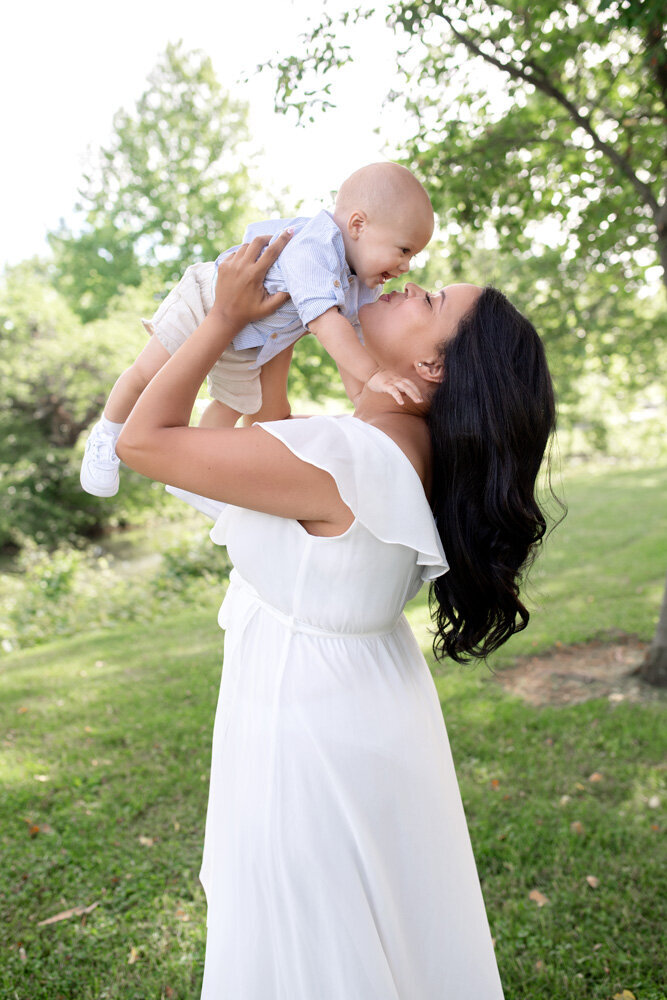 Family session of little boy and his mother in a dress