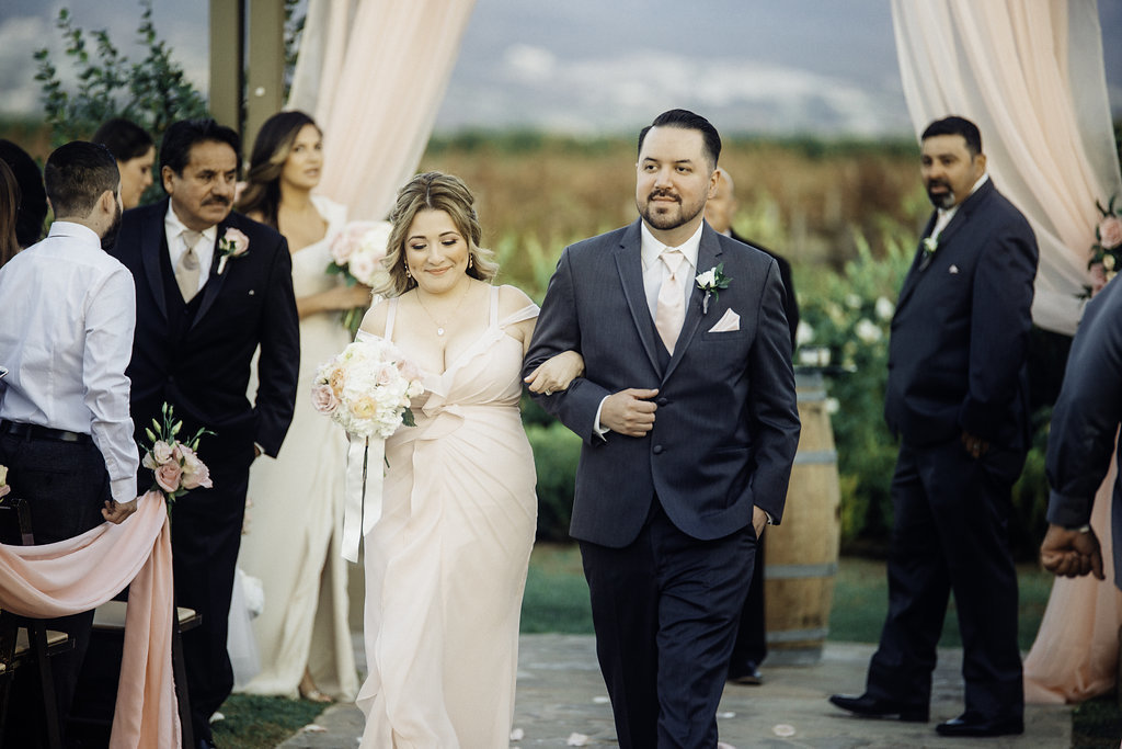 Wedding Photograph Of Bridesmaid And Groomsman Walking Los Angeles