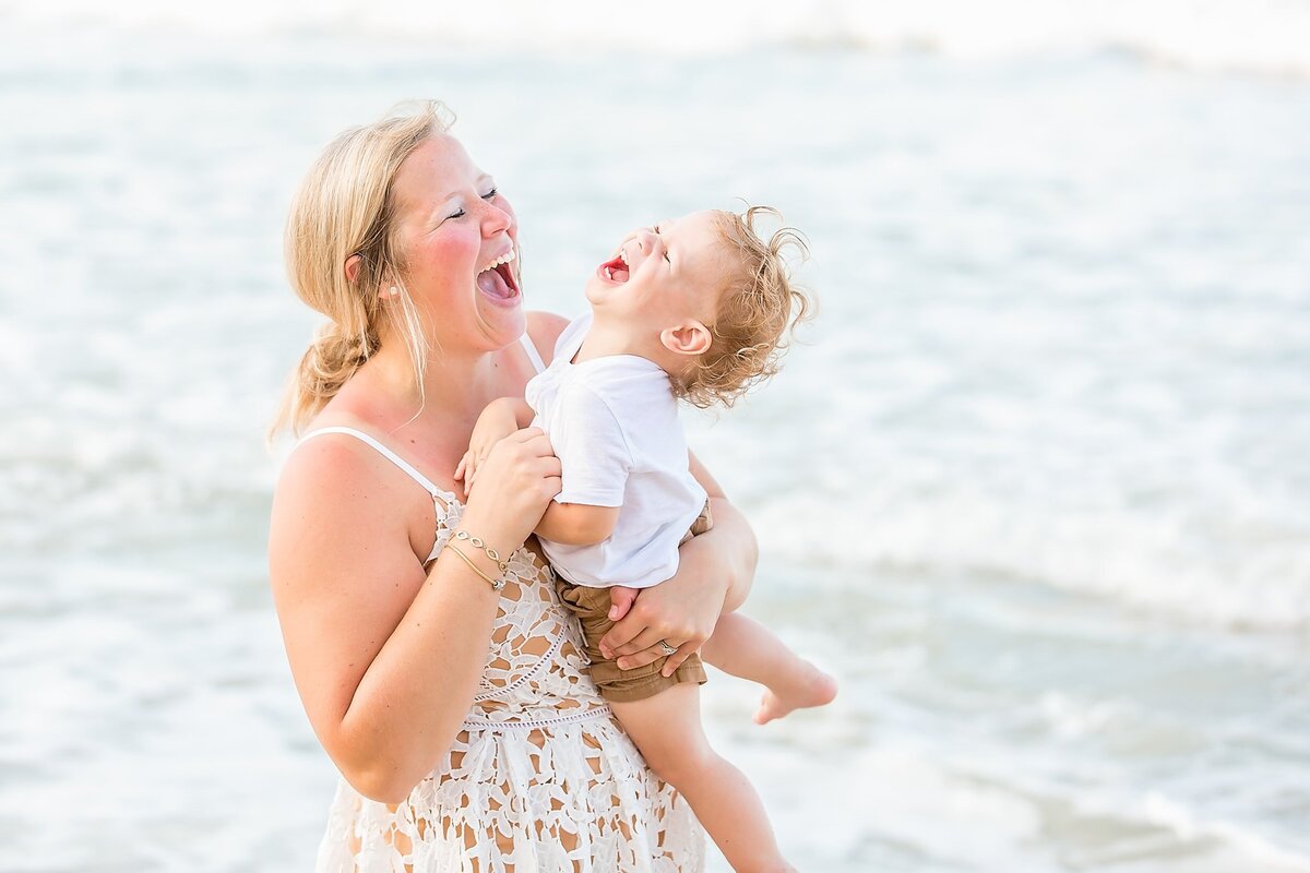 Mom and son laughing at the beach