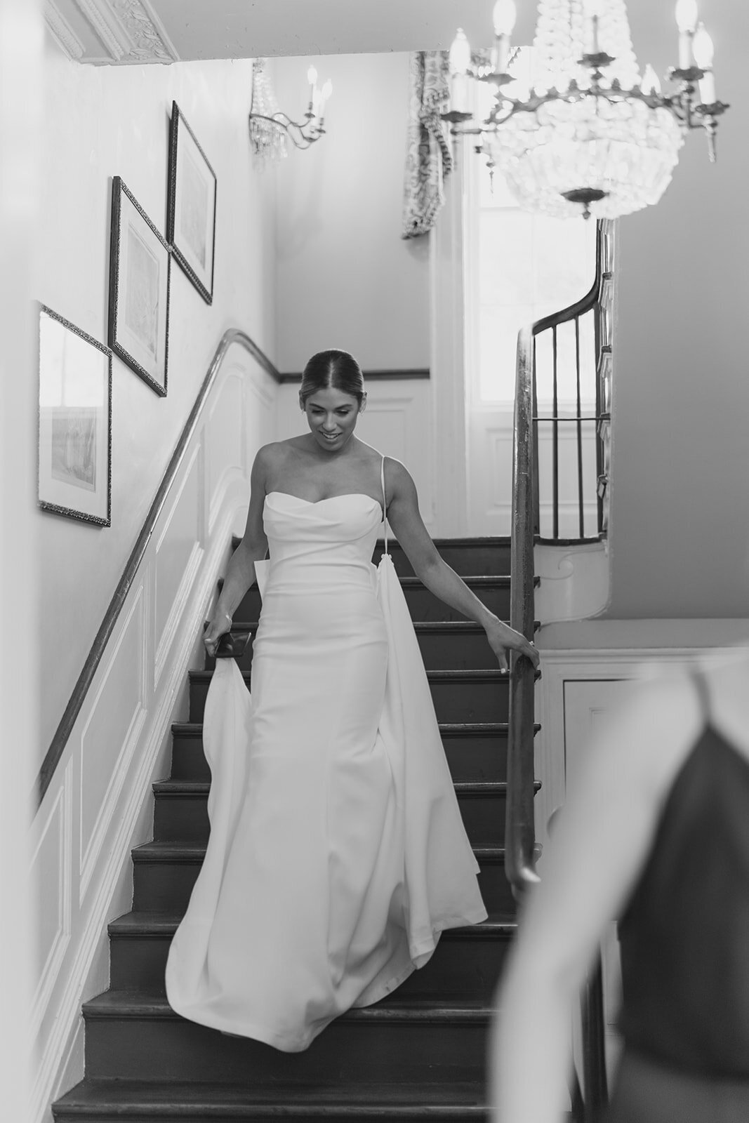 Bride walks down the steps at William Aiken House spring wedding. Kailee DiMeglio Photography. Black and white destination wedding photographer.