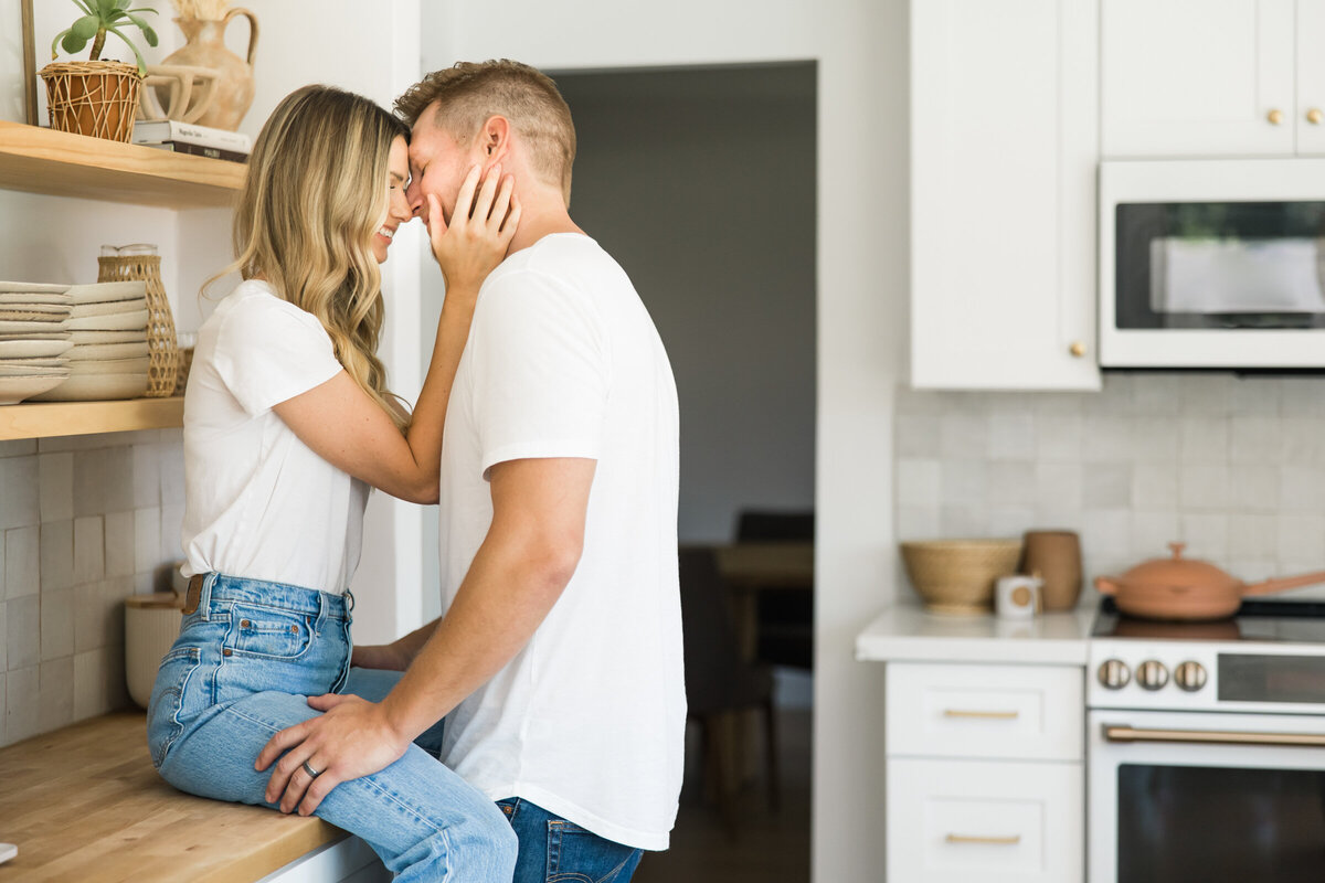 couple being romantic in their kitchen