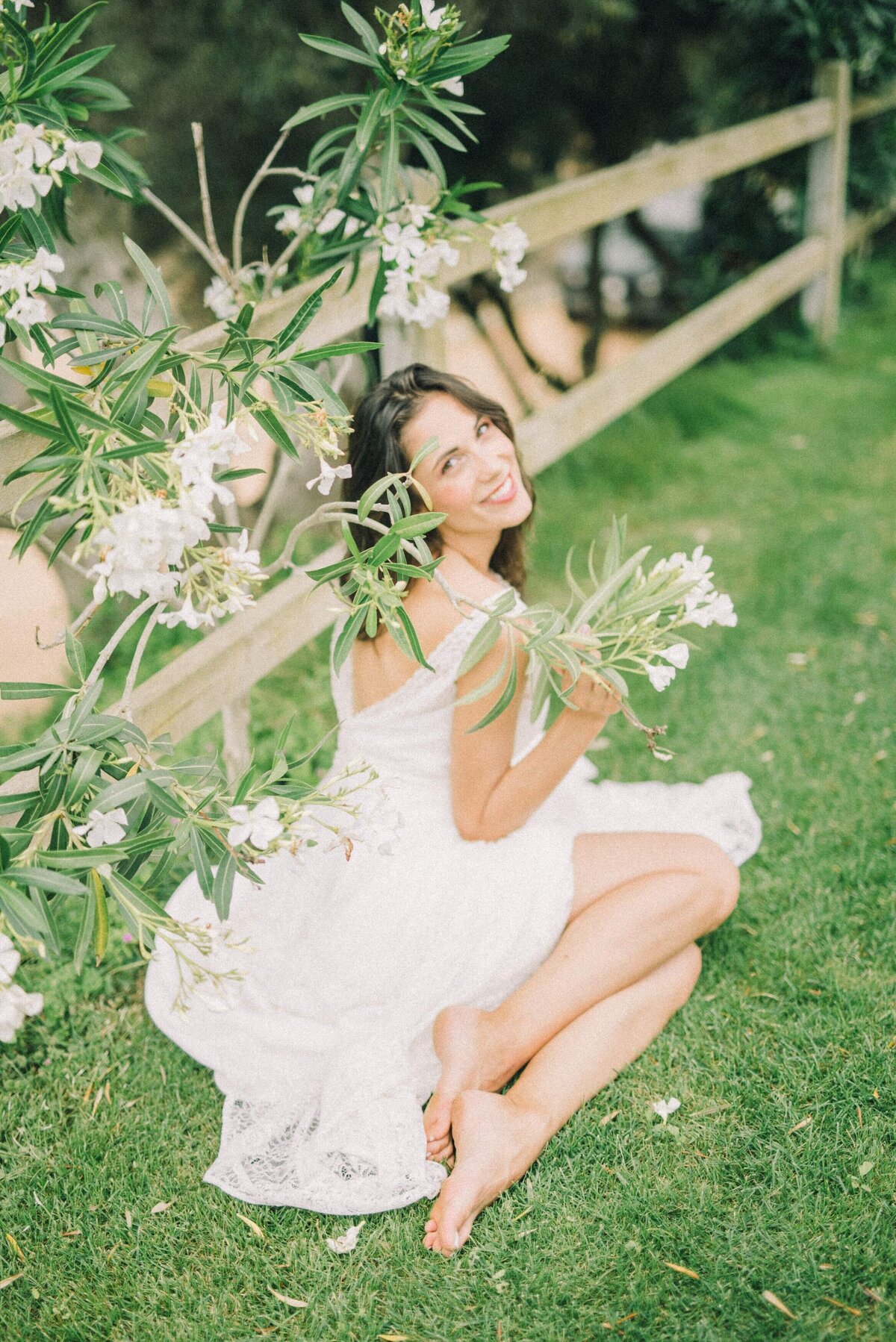 woman-in-white-dress-sitting-on-grass