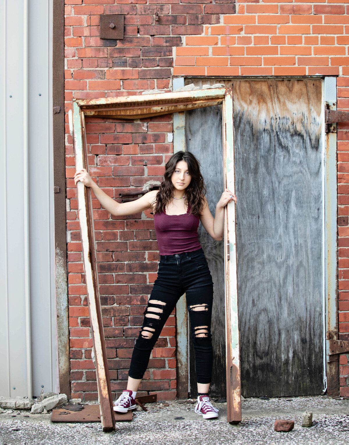 Photo of a senior posing in an urban location in Erie Pa