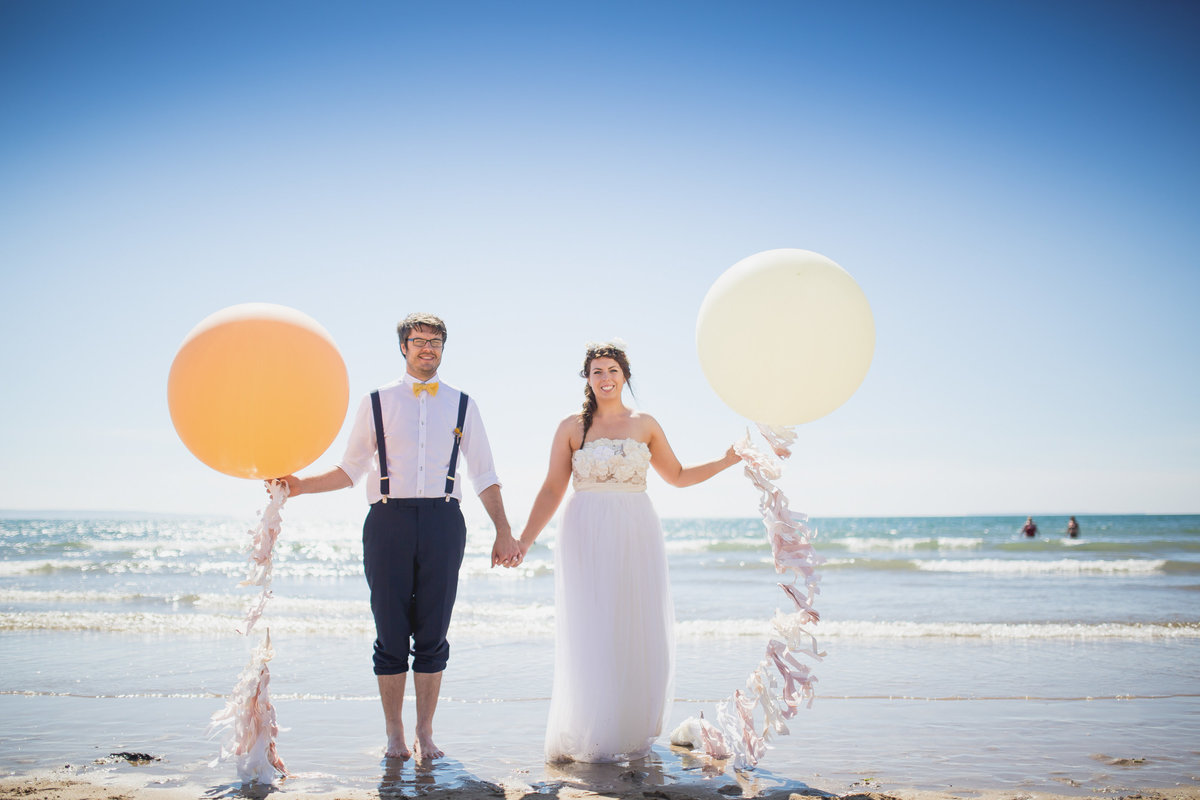 bride and groom with the giant balloon company