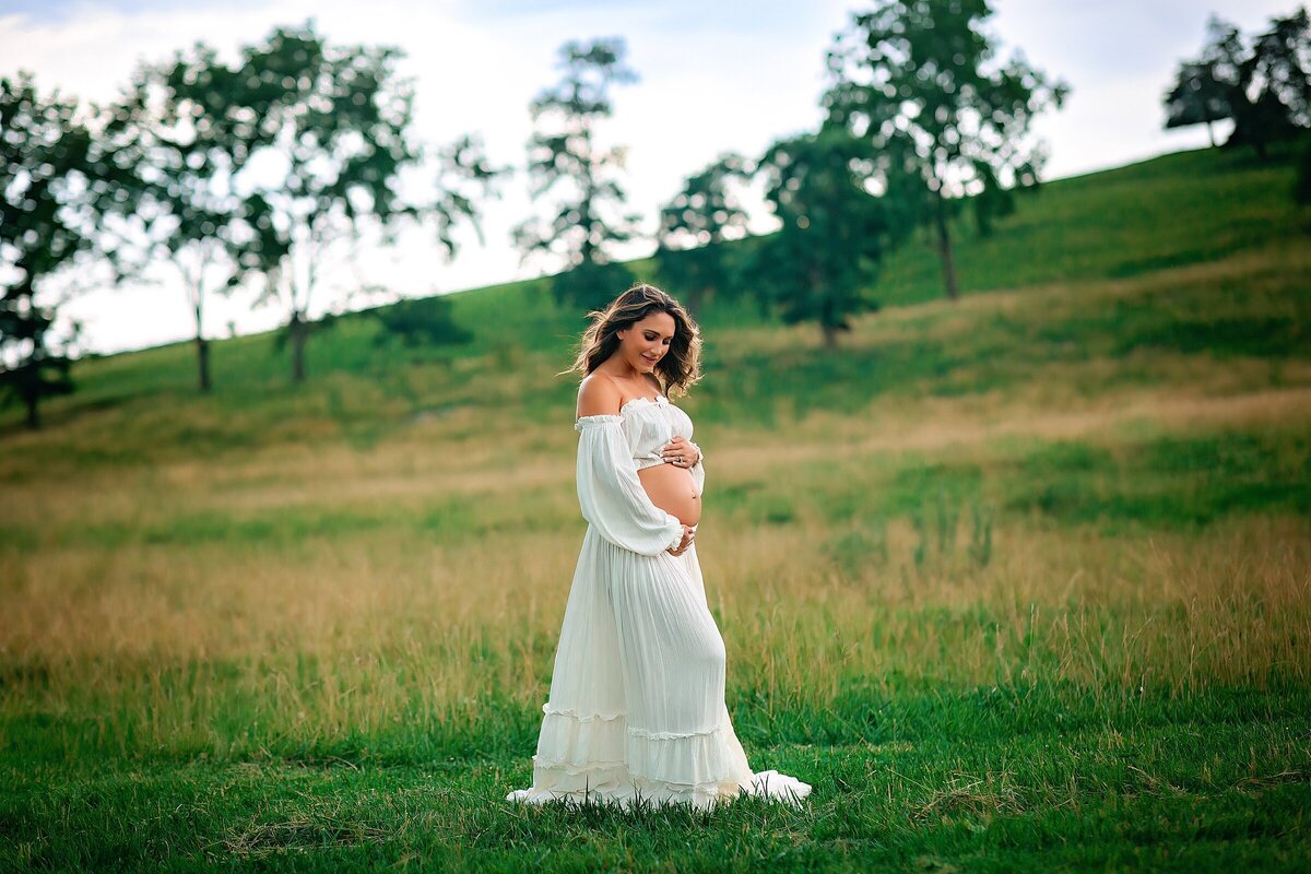 Maternity portrait session in a field in Harrisonburg VA by Be Thou My Vision Photography