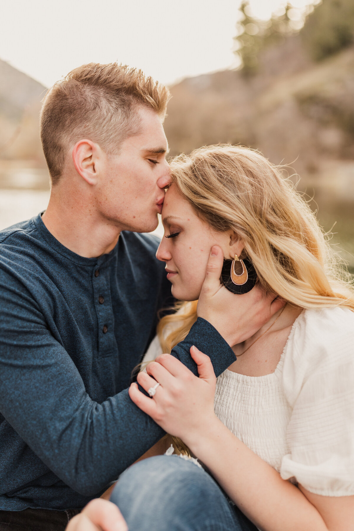 CJ kisses Karley in this photo at second dam up Logan Canyon in Utah. Taken by Robin Kunzler Photo